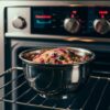 A close-up image of a shiny stainless steel bowl sitting on an oven rack. The oven is preheating, with digital controls displaying the set temperature. The bowl holds a mix of colorful, delicious-looking ingredients, ready for baking. The overall ambiance of the image is warm and inviting, with a sense of anticipation for the culinary delight that awaits.